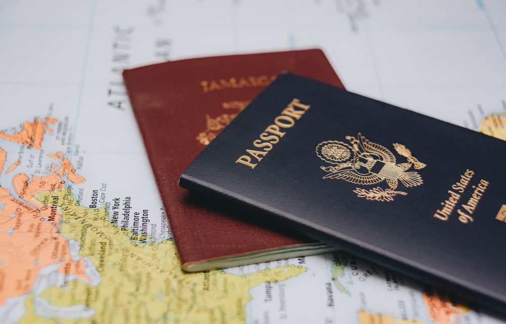 united-states-passport-and-jamaican-passport-on-world-map.jpg